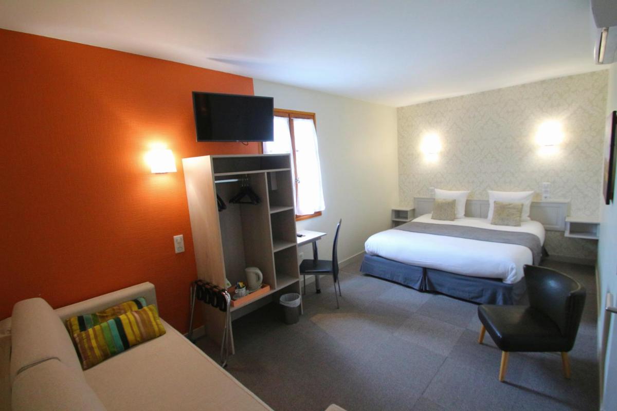 Un ou plusieurs lits dans un hébergement de l'établissement Logis Hotel Archambeau