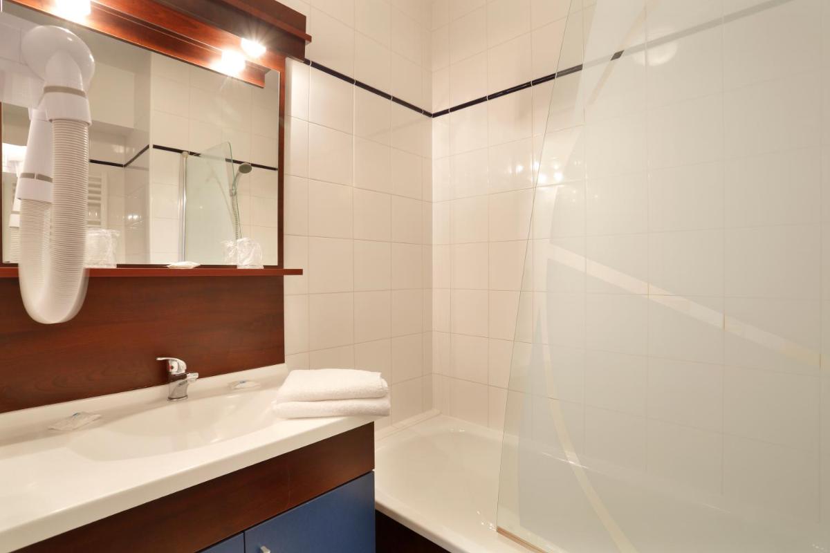 Salle de bains dans l'établissement Vacancéole - Appart'Vacances Pyrénées 2000