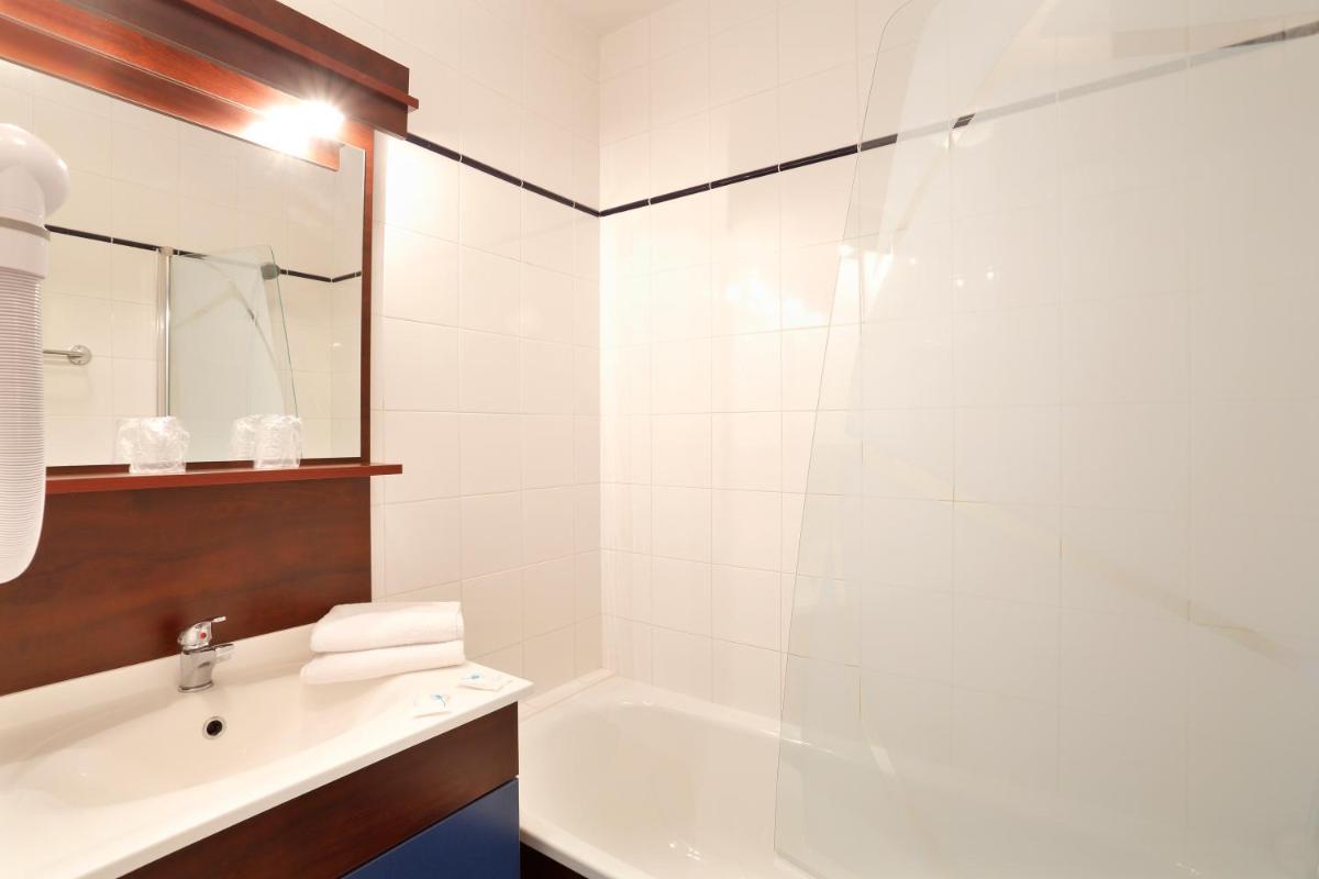 Salle de bains dans l'établissement Vacancéole - Appart'Vacances Pyrénées 2000