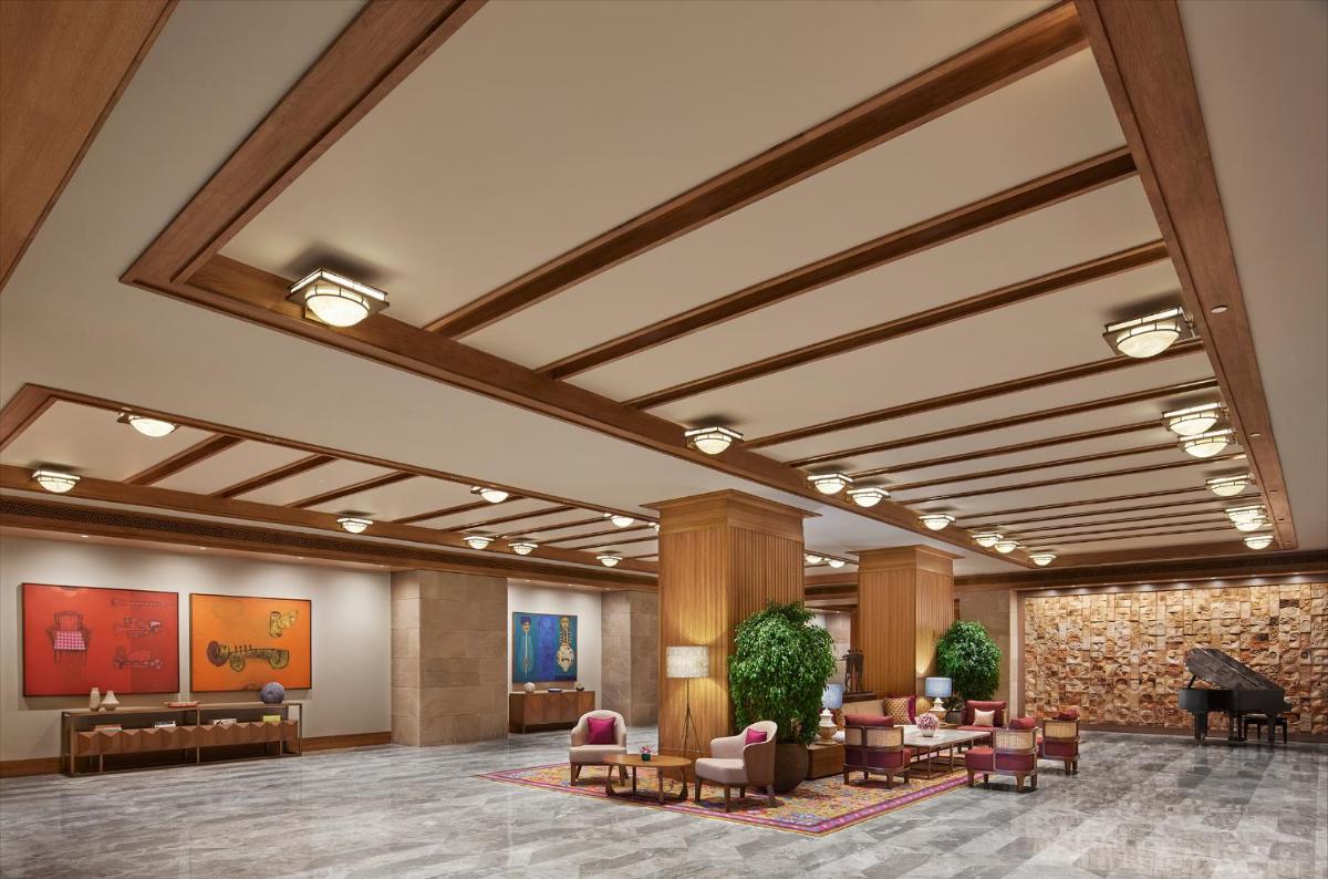 a rendering of a lobby with couches and chairs at Taj City Centre New Town, Kolkata in Kolkata a rendering of a lobby with couches and chairs at Taj City Centre New Town, Kolkata in Kolkata