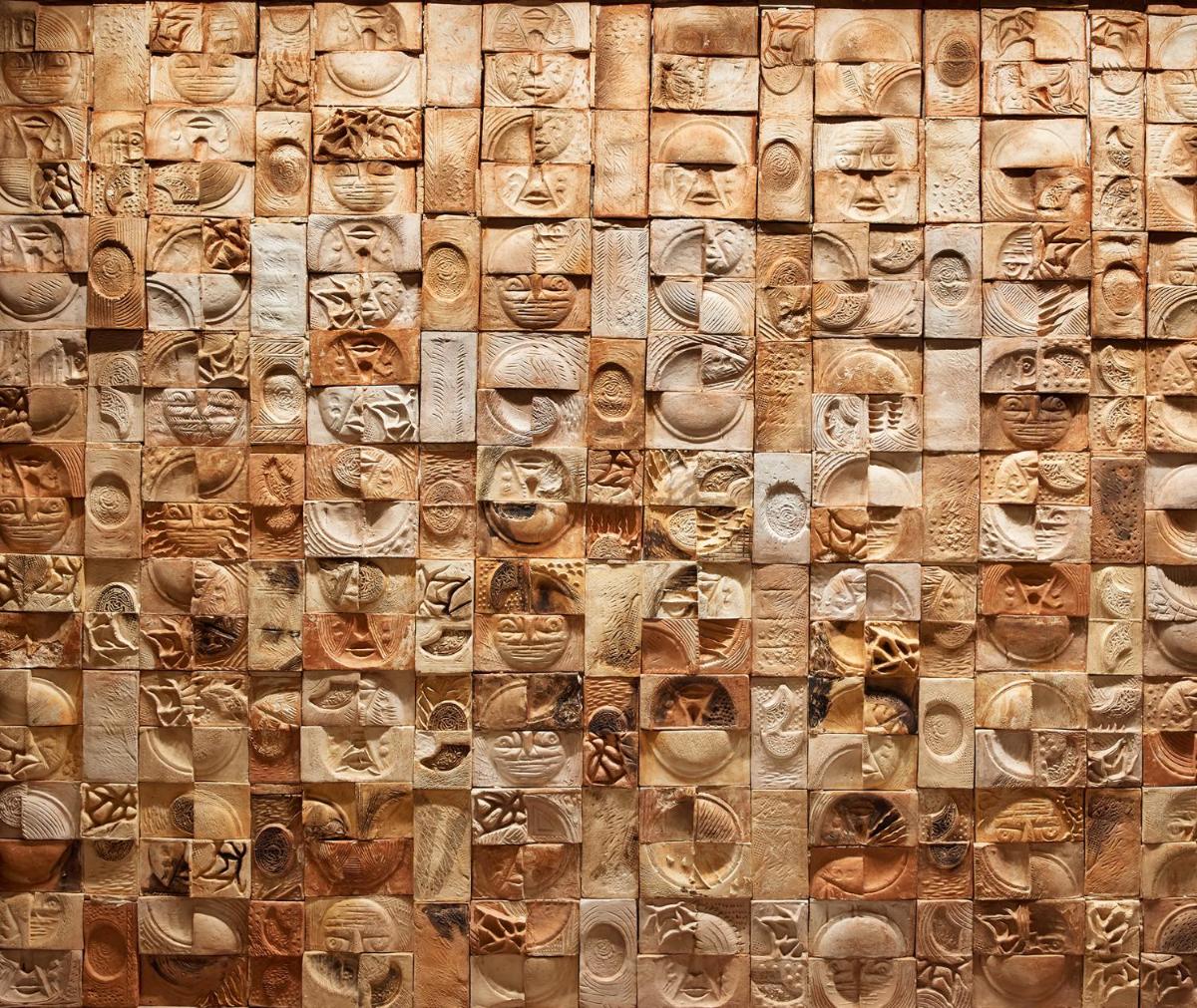 a wooden wall with faces painted on it at Taj City Centre New Town, Kolkata in Kolkata a wooden wall with faces painted on it at Taj City Centre New Town, Kolkata in Kolkata