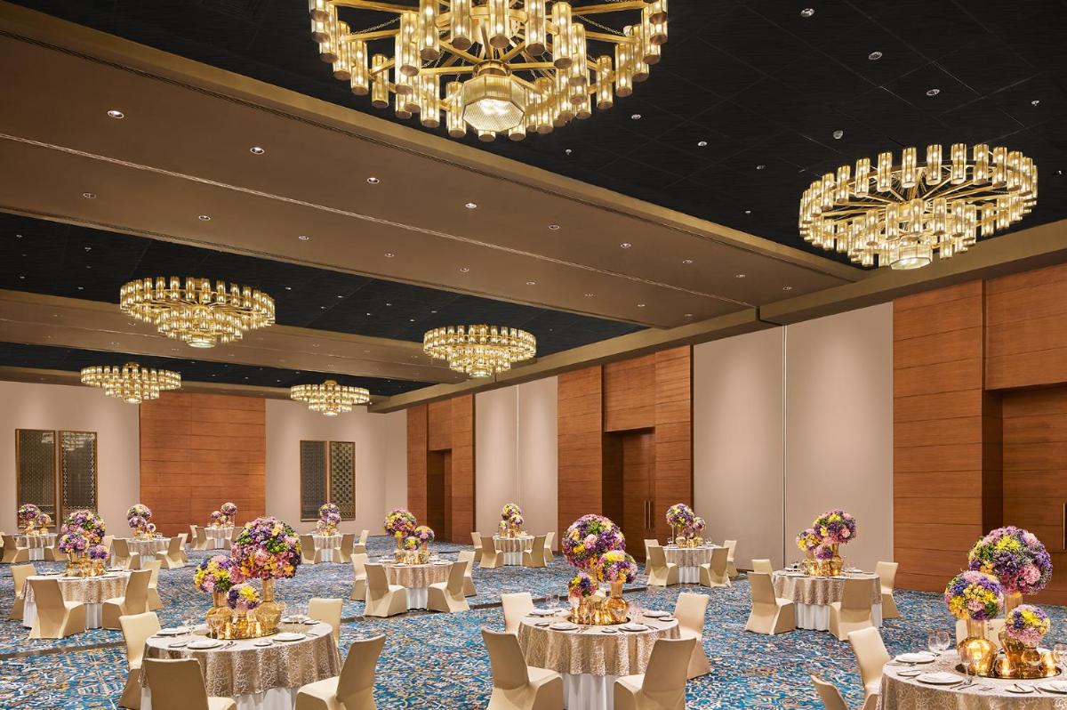 a banquet hall with white tables and chandeliers at Taj City Centre New Town, Kolkata in Kolkata +34 photos a banquet hall with white tables and chandeliers at Taj City Centre New Town, Kolkata in Kolkata +34 photos