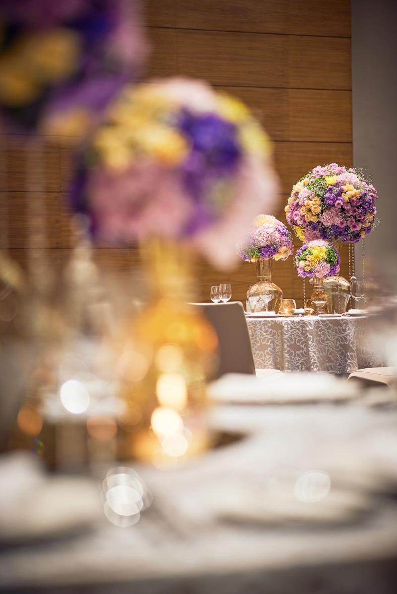 a table with vases of flowers on top of it at Taj City Centre New Town, Kolkata in Kolkata a table with vases of flowers on top of it at Taj City Centre New Town, Kolkata in Kolkata