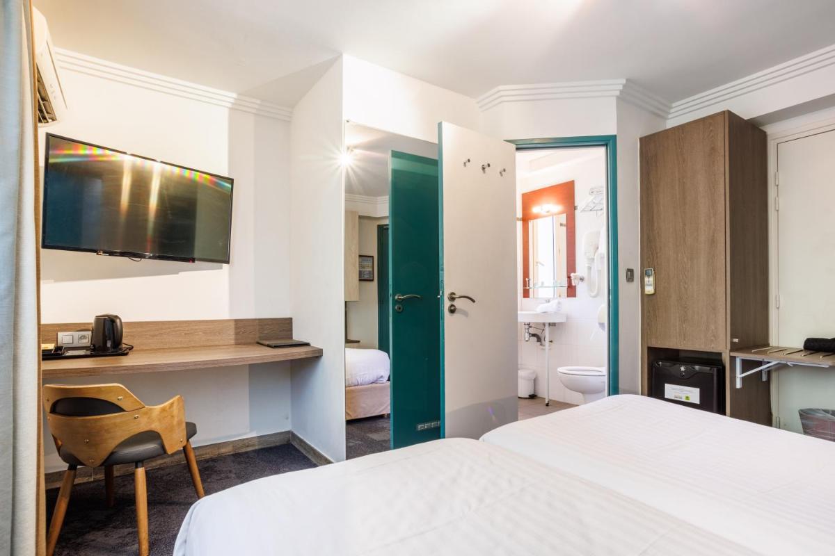 Un ou plusieurs lits dans un hébergement de l'établissement Hotel SPA Plage St Jean