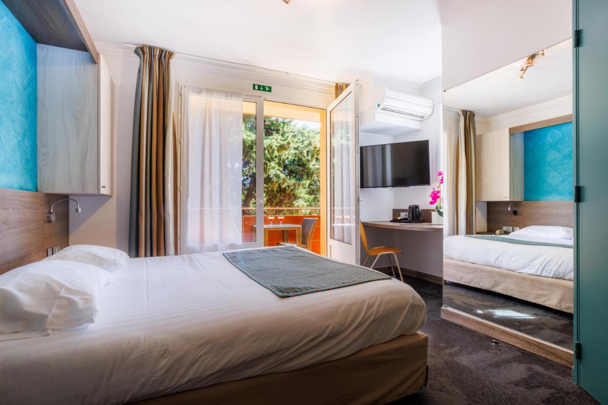 Un ou plusieurs lits dans un hébergement de l'établissement Hotel SPA Plage St Jean