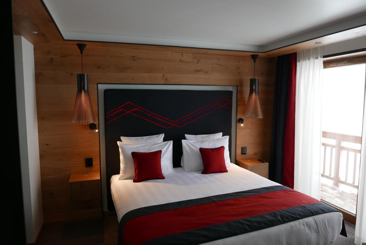Un ou plusieurs lits dans un hébergement de l'établissement Hôtel Alparena & Spa - 4 étoiles