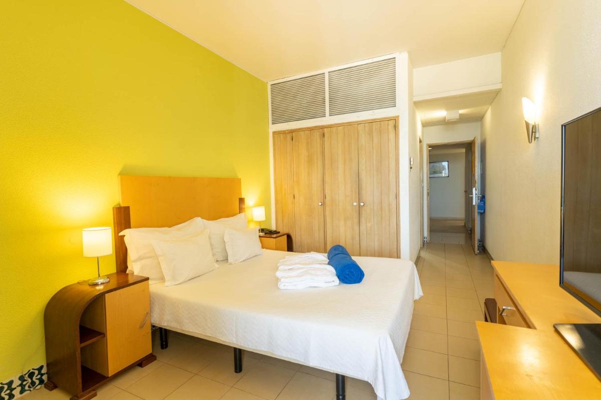 Uma cama ou camas num quarto em Boa Vista Hotel & Spa - Adults Only