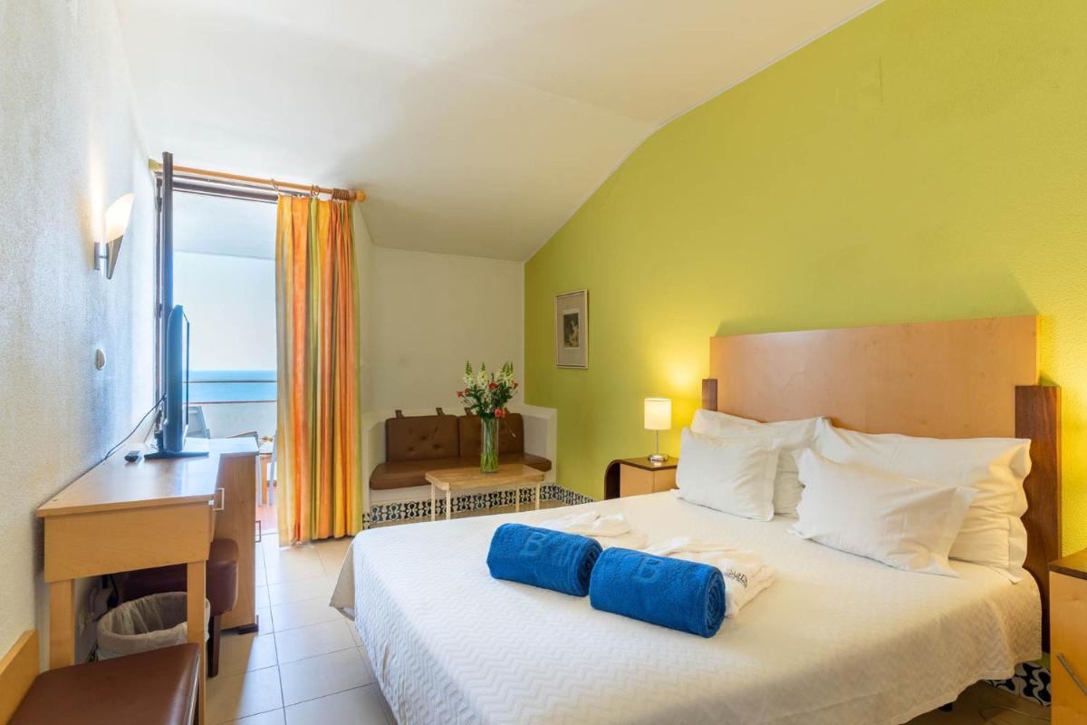 Uma cama ou camas num quarto em Boa Vista Hotel & Spa - Adults Only