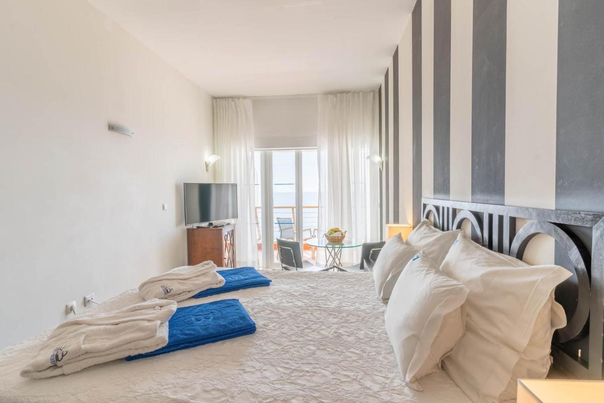 Uma cama ou camas num quarto em Boa Vista Hotel & Spa - Adults Only
