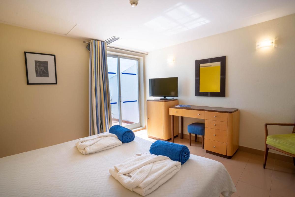Uma cama ou camas num quarto em Boa Vista Hotel & Spa - Adults Only