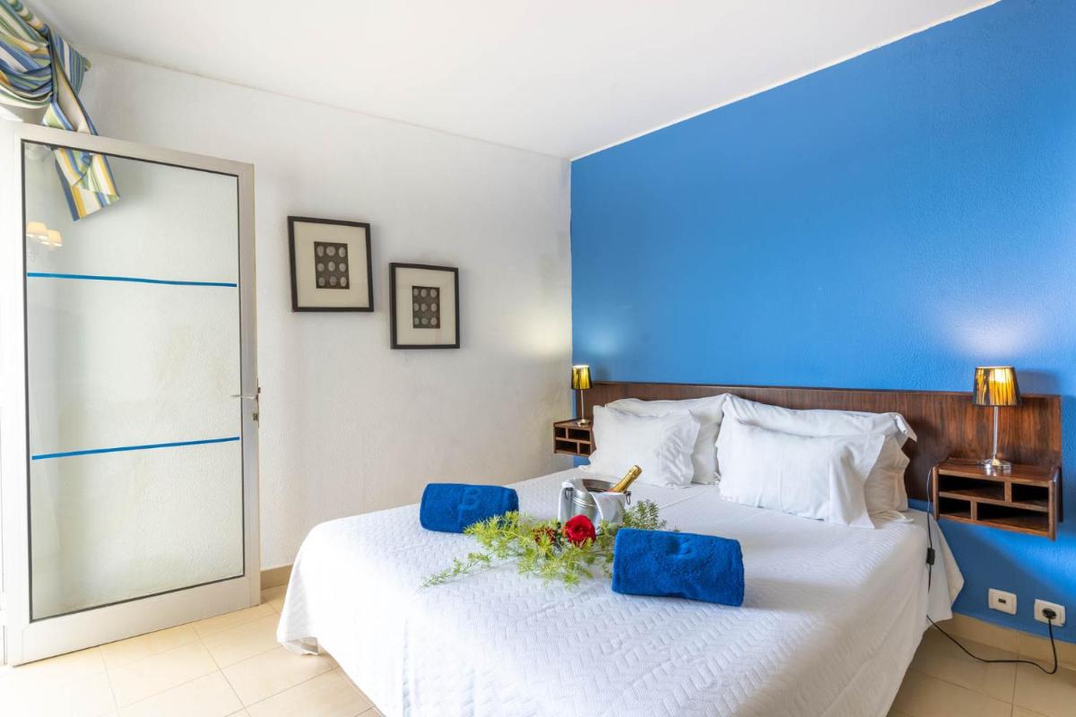 Uma cama ou camas num quarto em Boa Vista Hotel & Spa - Adults Only