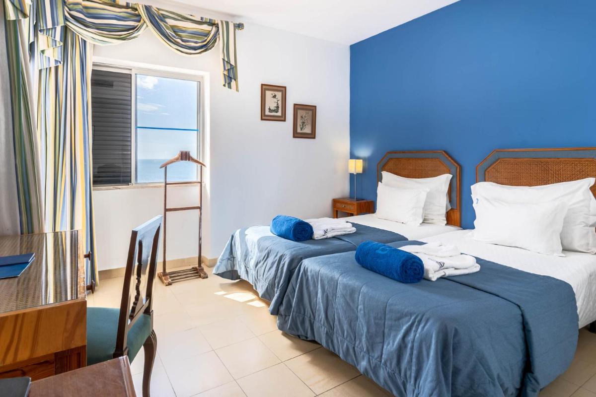 Uma cama ou camas num quarto em Boa Vista Hotel & Spa - Adults Only
