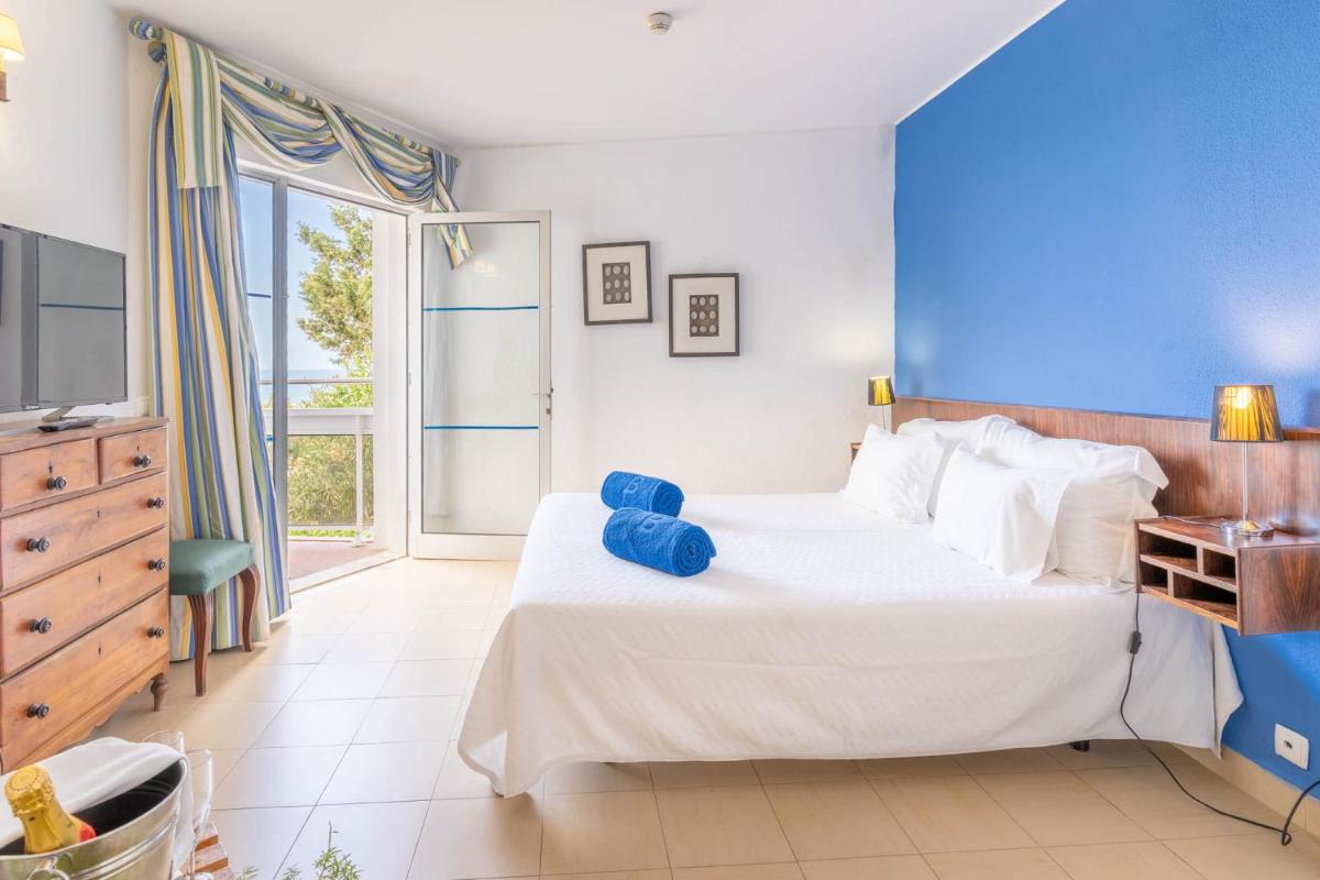 Uma cama ou camas num quarto em Boa Vista Hotel & Spa - Adults Only