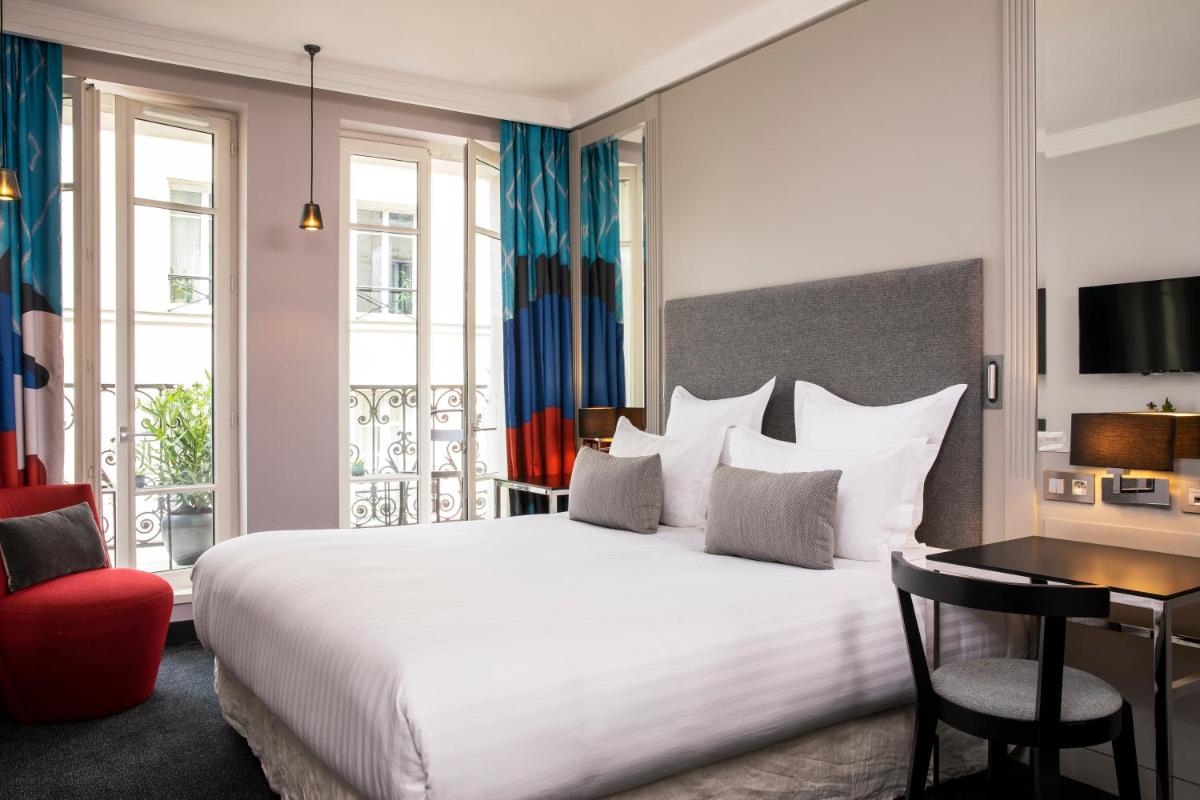 Un ou plusieurs lits dans un hébergement de l'établissement Les Matins de Paris & Spa
