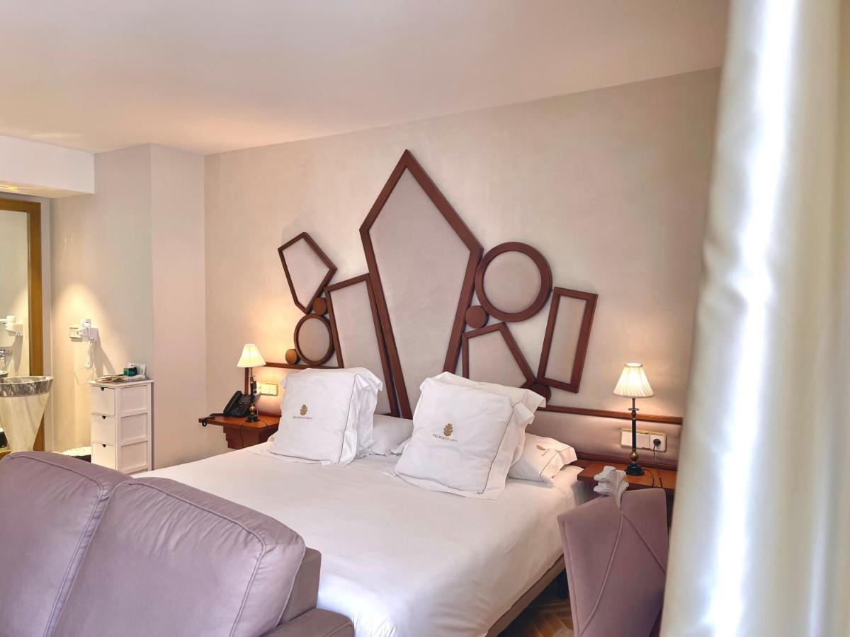 Cama o camas de una habitación en Hotel Palacio De Úbeda 5 G.L