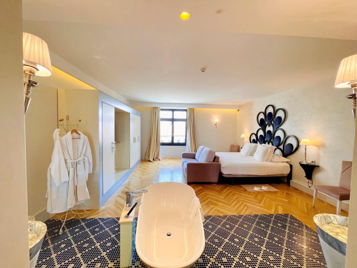 Cama o camas de una habitación en Hotel Palacio De Úbeda 5 G.L