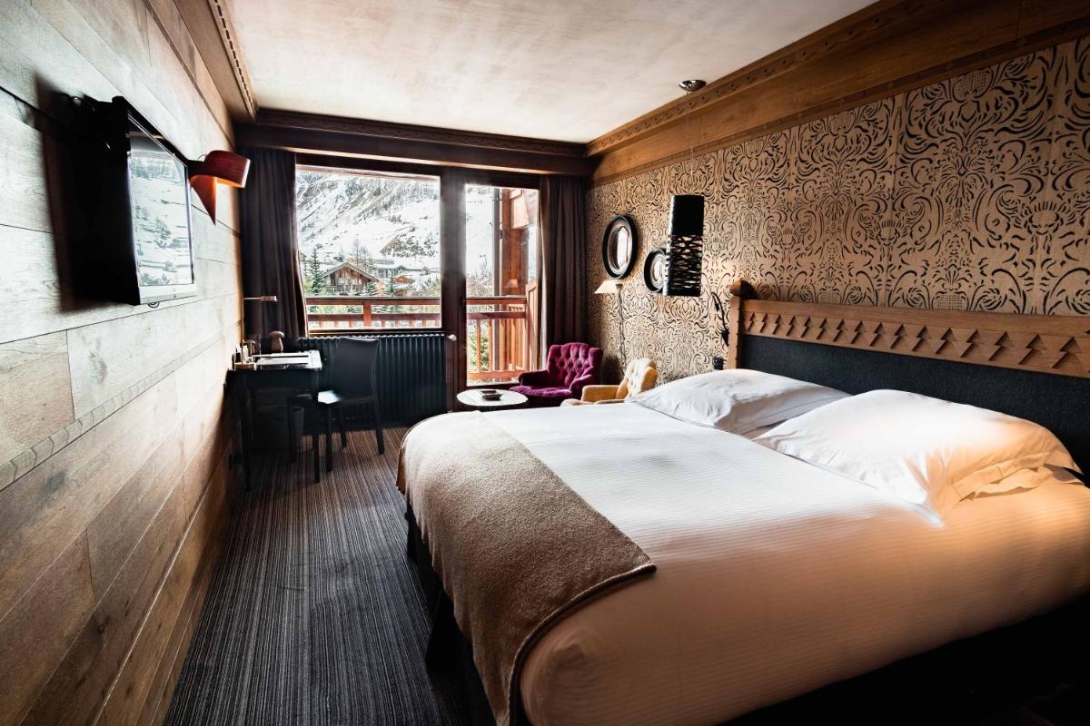 Un ou plusieurs lits dans un hébergement de l'établissement Hôtel LE BLIZZARD