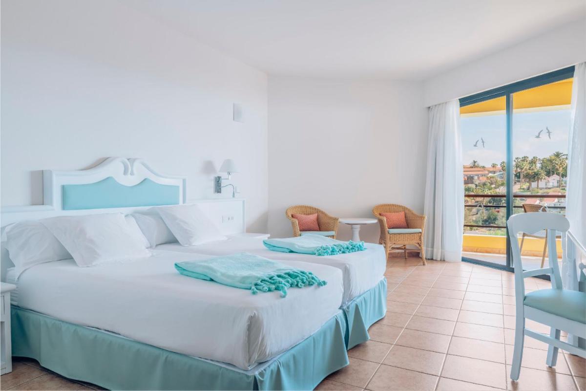 Cama o camas de una habitación en Iberostar Waves Playa Gaviotas All Inclusive