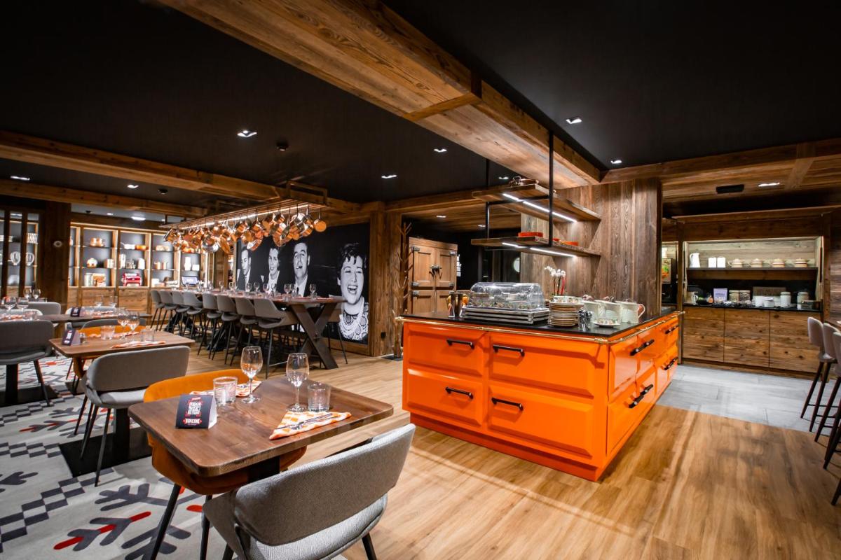 Restaurant ou autre lieu de restauration dans l'établissement Hôtel Névé