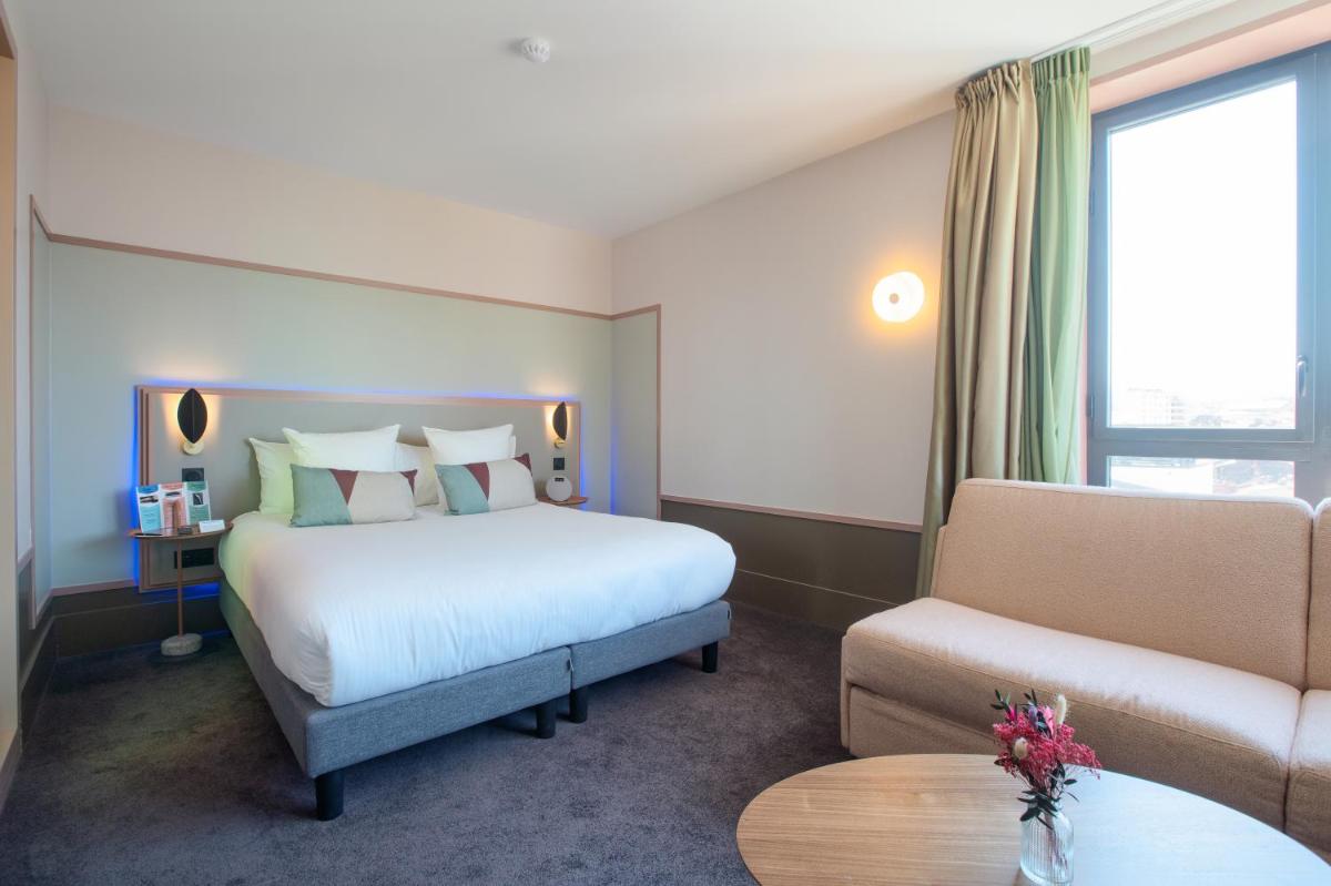 Un ou plusieurs lits dans un hébergement de l'établissement Aiden by Best Western Clermont-Ferrand Hotel & Spa