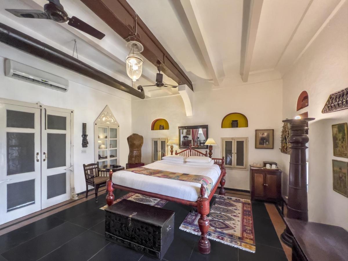 a bedroom with a bed in a room at Neemrana Fort-Palace in Neemrana