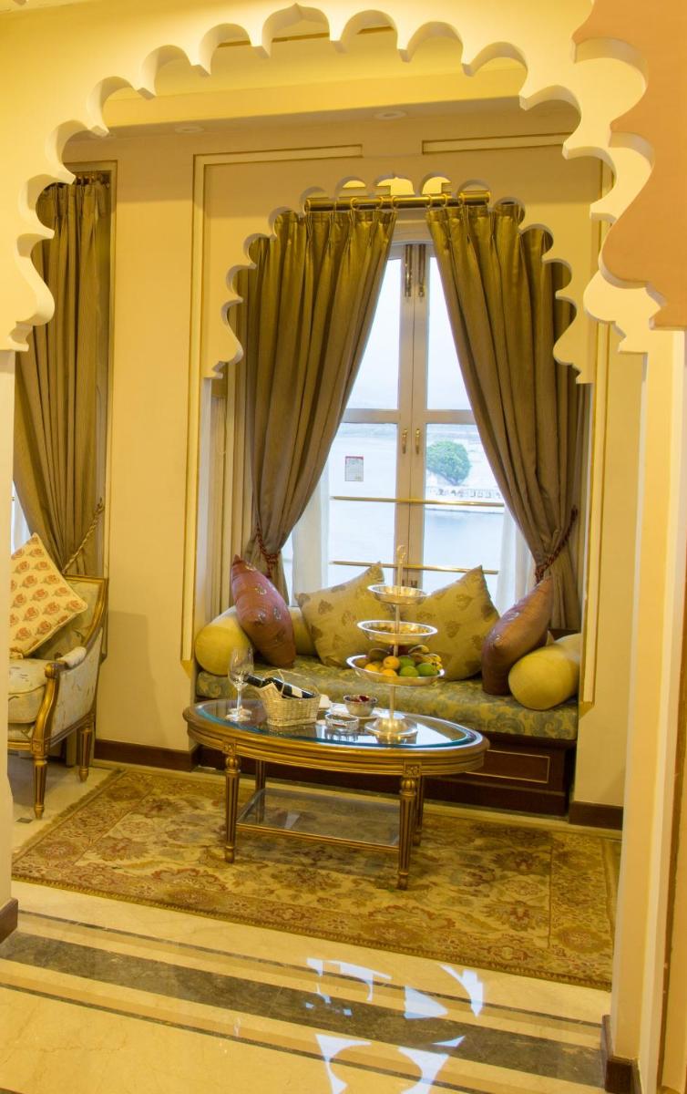 a living room with a couch and a table at Taj Fateh Prakash Palace Udaipur in Udaipur