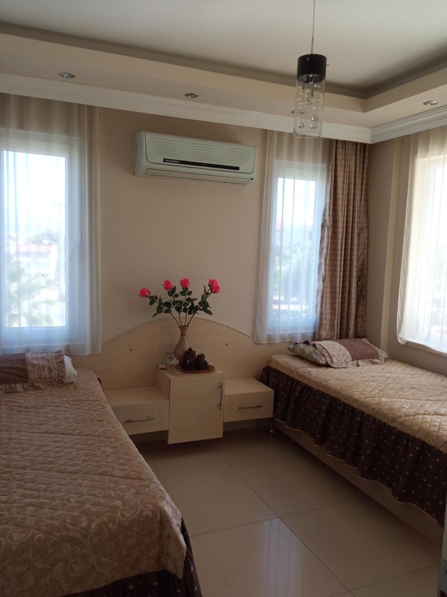 Suitetrails - Sunshine apartment at Side beach.