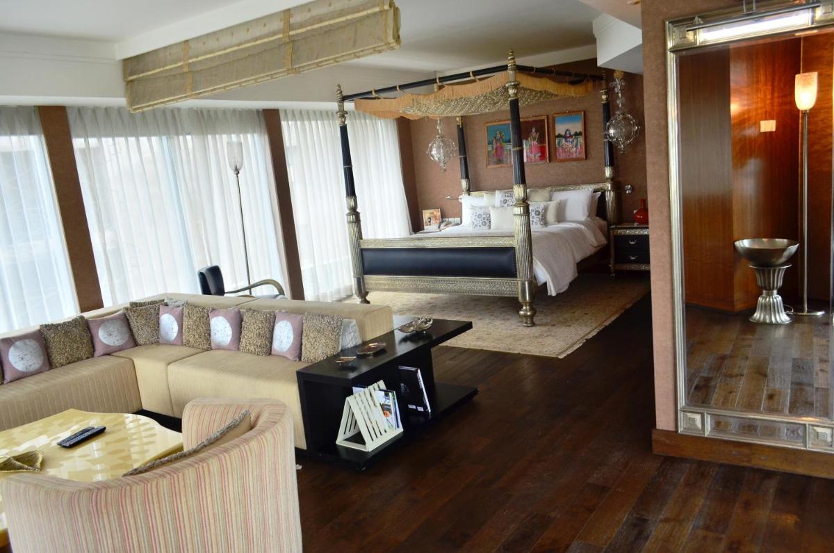 a living room with a couch and a bed at The Park Hyderabad, Banjara Hills near Hussain Sagar Lake in Hyderabad a living room with a couch and a bed at The Park Hyderabad, Banjara Hills near Hussain Sagar Lake in Hyderabad