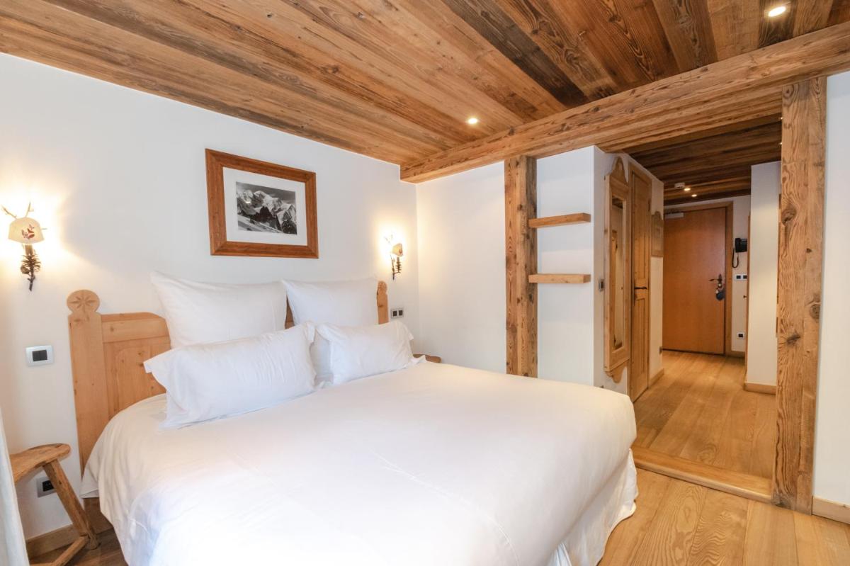 Un ou plusieurs lits dans un hébergement de l'établissement Chalet-Hôtel Hermitage