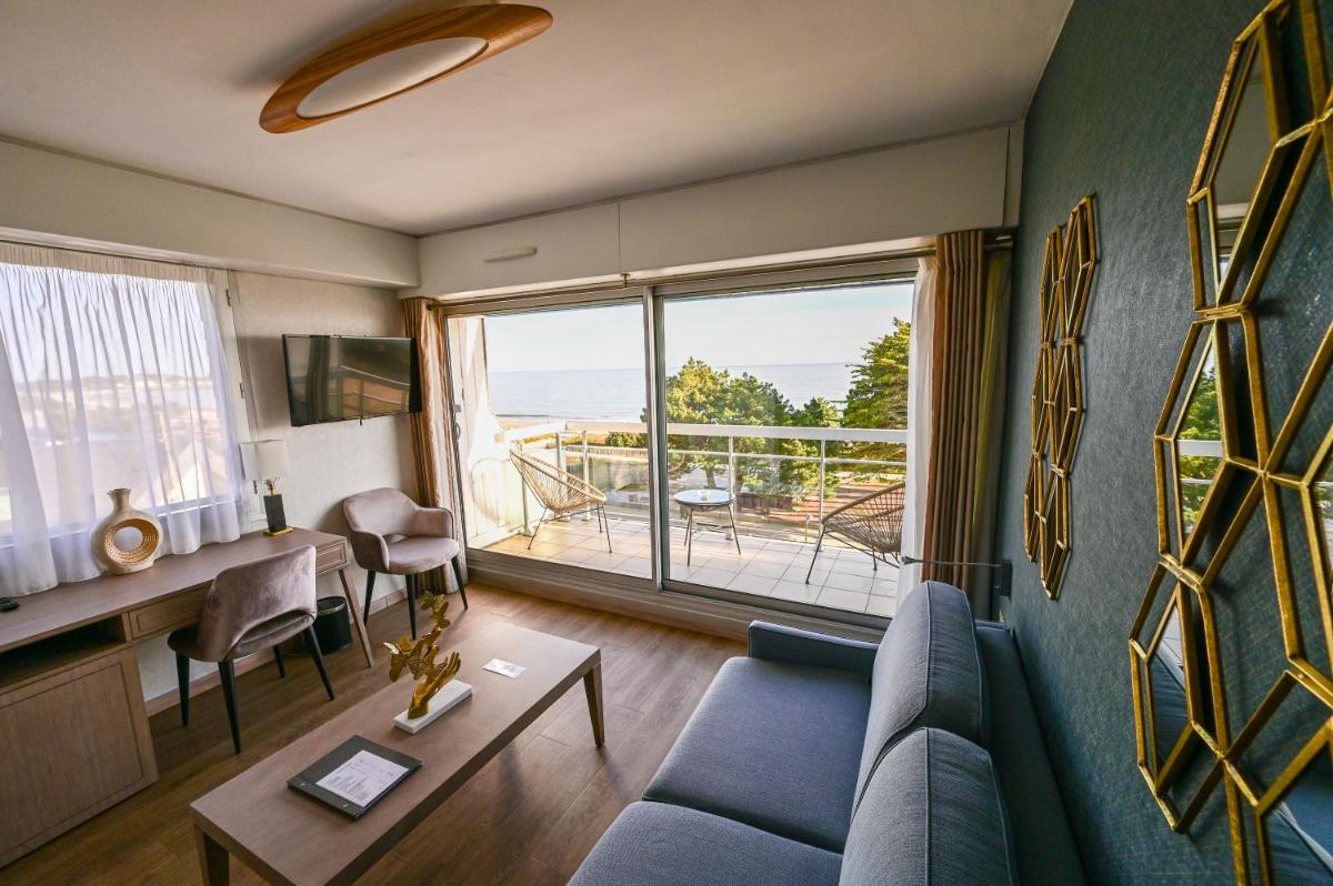 Coin salon dans l'établissement Le Diana Hôtel & Spa