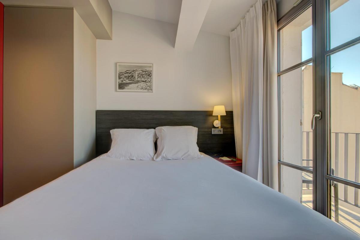Un ou plusieurs lits dans un hébergement de l'établissement Alex Hotel & Spa