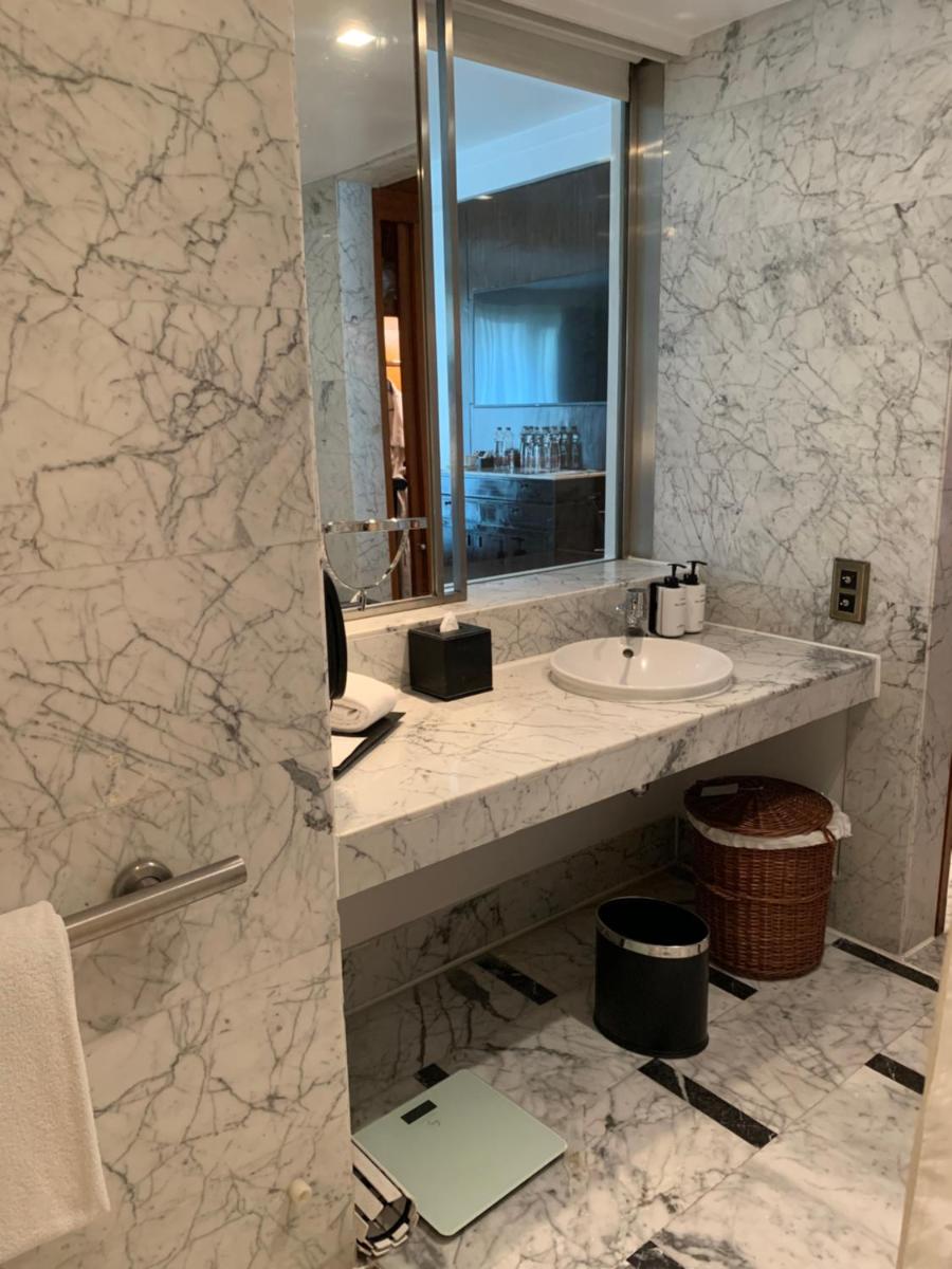 a bathroom with a sink and a mirror at InterContinental Marine Drive Mumbai by IHG in Mumbai