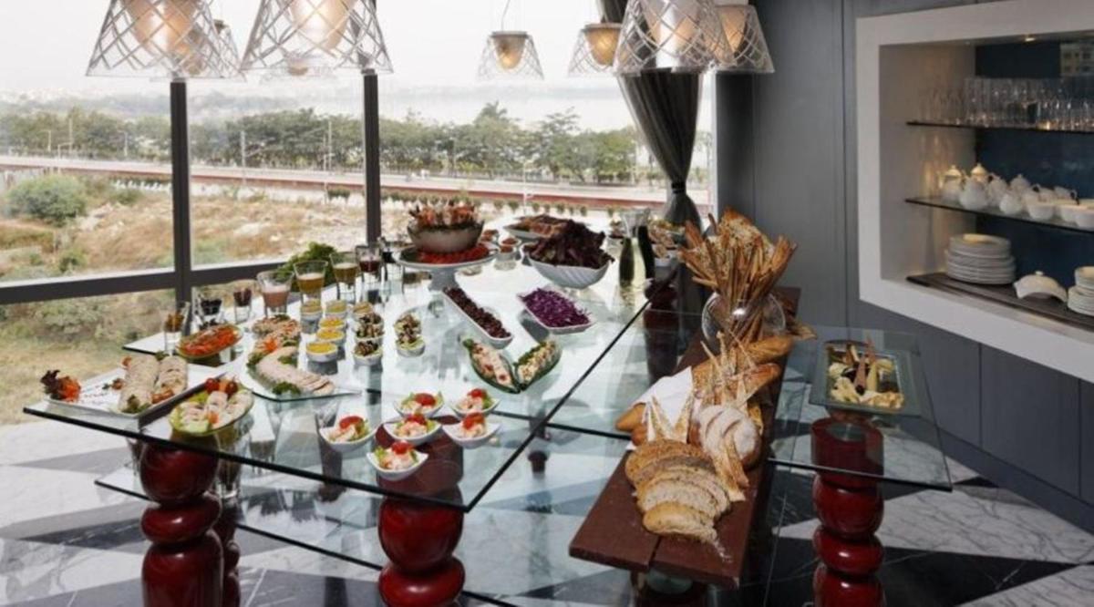 a buffet of food on a glass table at The Park Hyderabad, Banjara Hills near Hussain Sagar Lake in Hyderabad a buffet of food on a glass table at The Park Hyderabad, Banjara Hills near Hussain Sagar Lake in Hyderabad