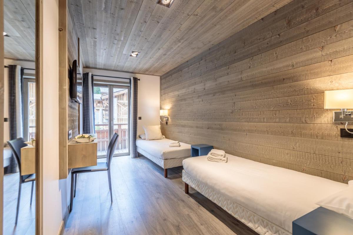 Un ou plusieurs lits dans un hébergement de l'établissement Victoria Lodge, Friendly Hotel