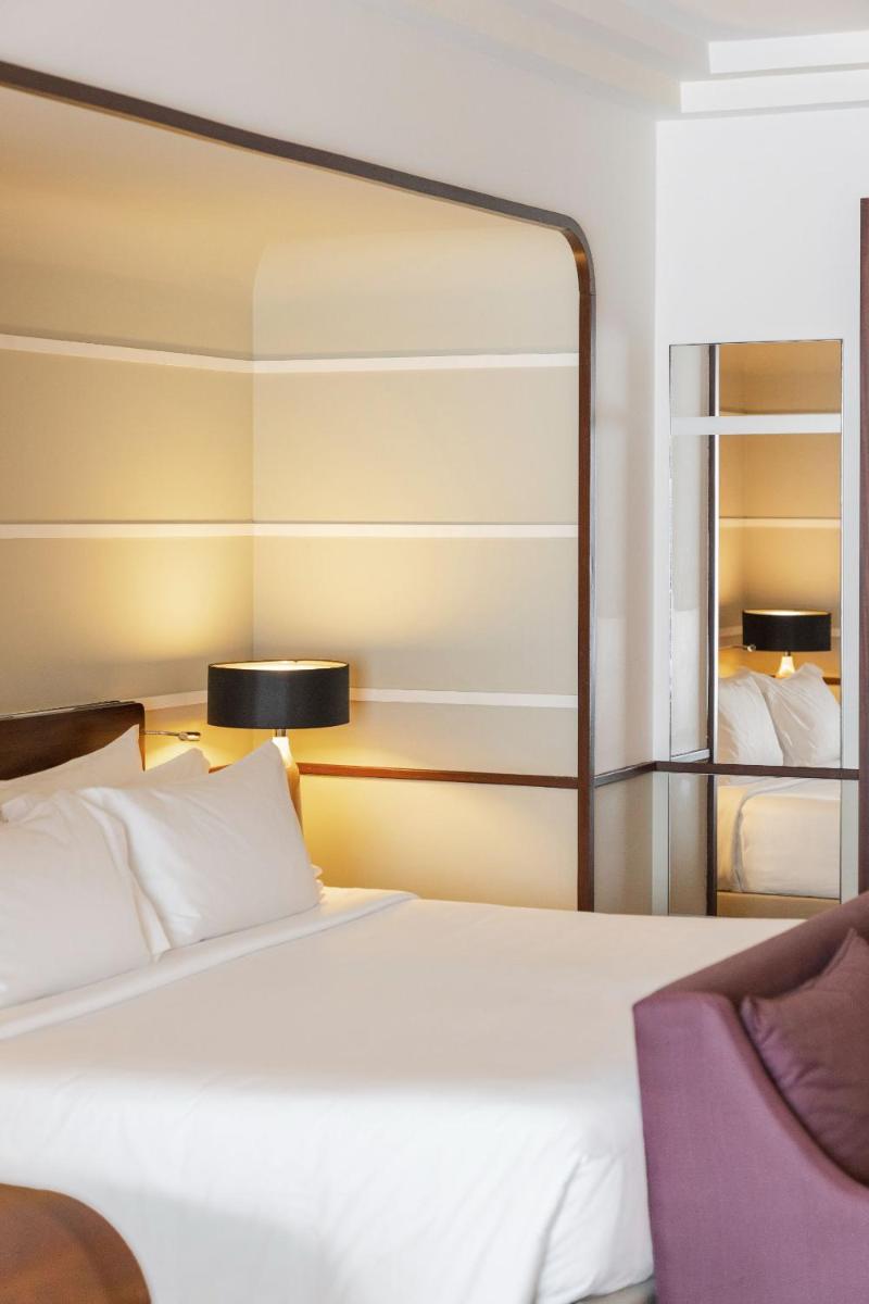 Uma cama ou camas num quarto em Terra Nostra Garden Hotel