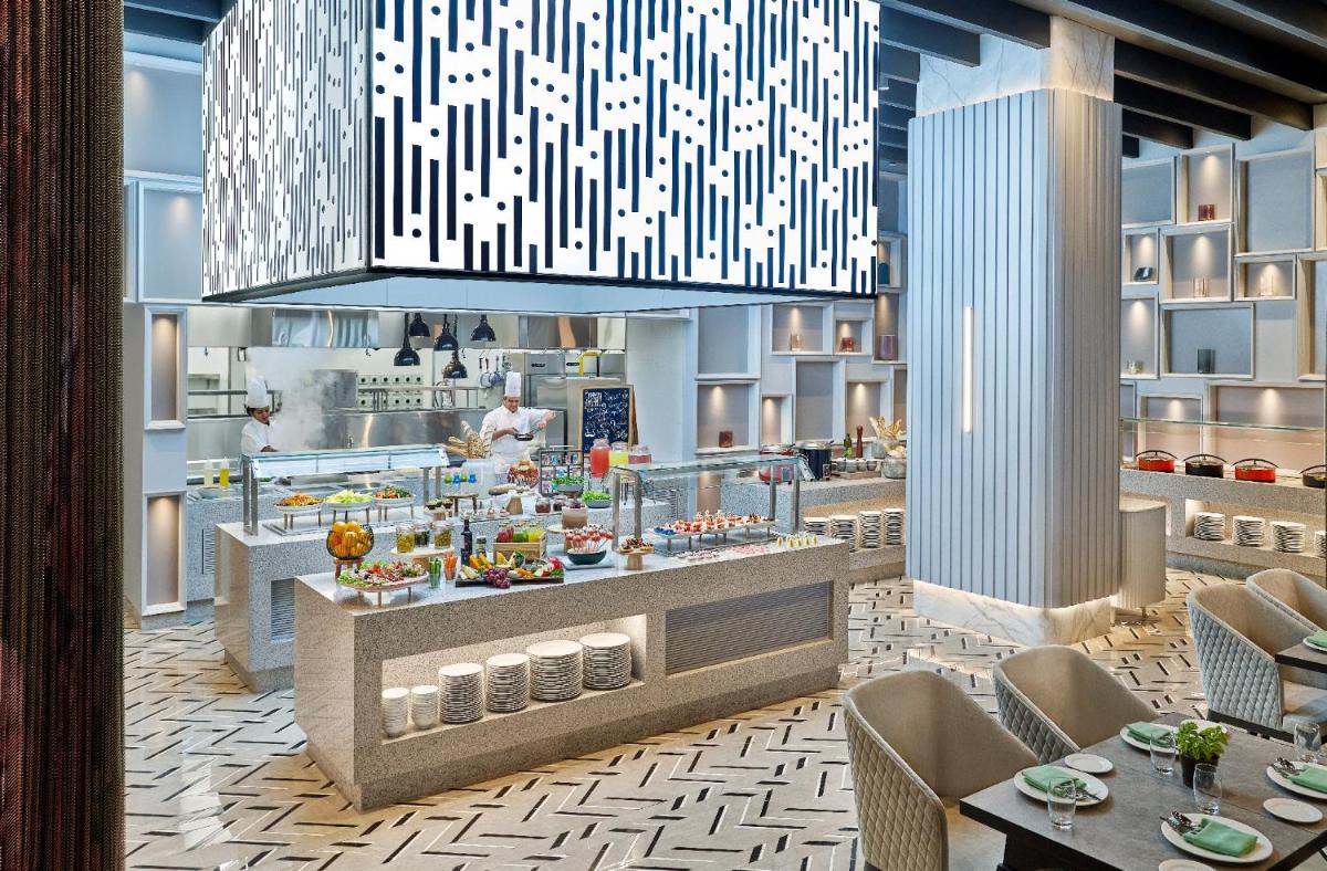 a rendering of a restaurant with a buffet at Vivanta Navi Mumbai Turbhe in Navi Mumbai