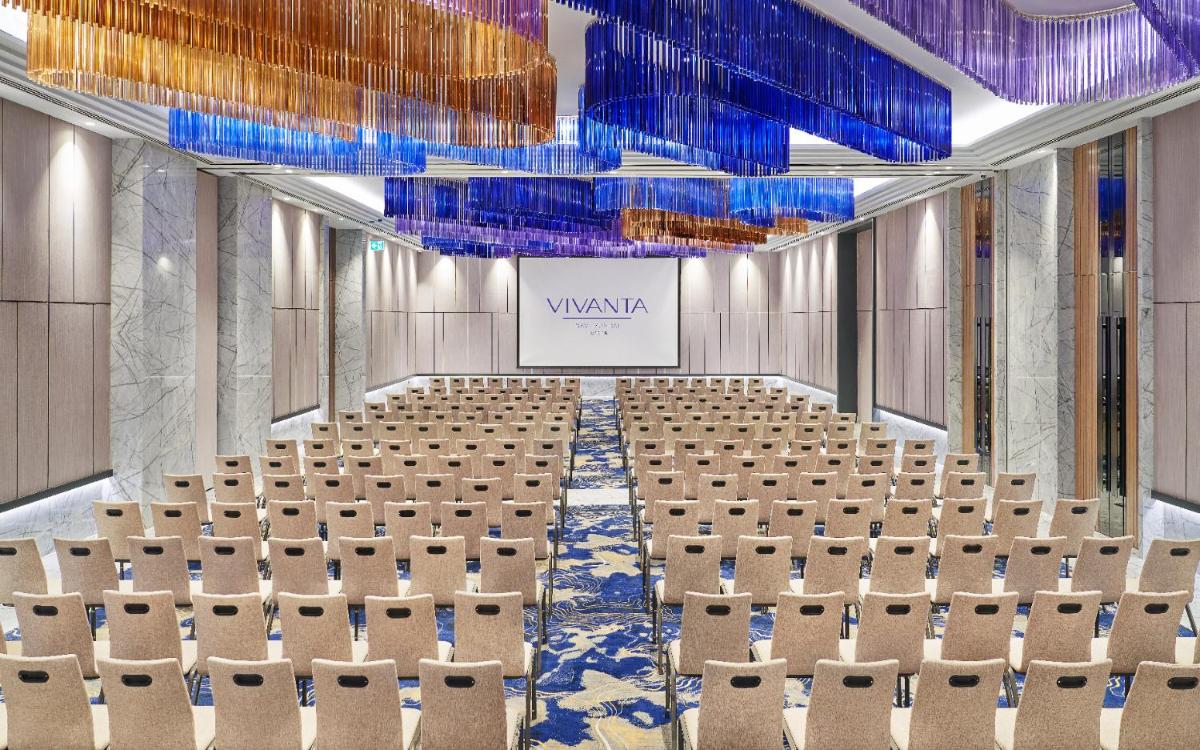 an image of a conference room with chairs and a screen at Vivanta Navi Mumbai Turbhe in Navi Mumbai