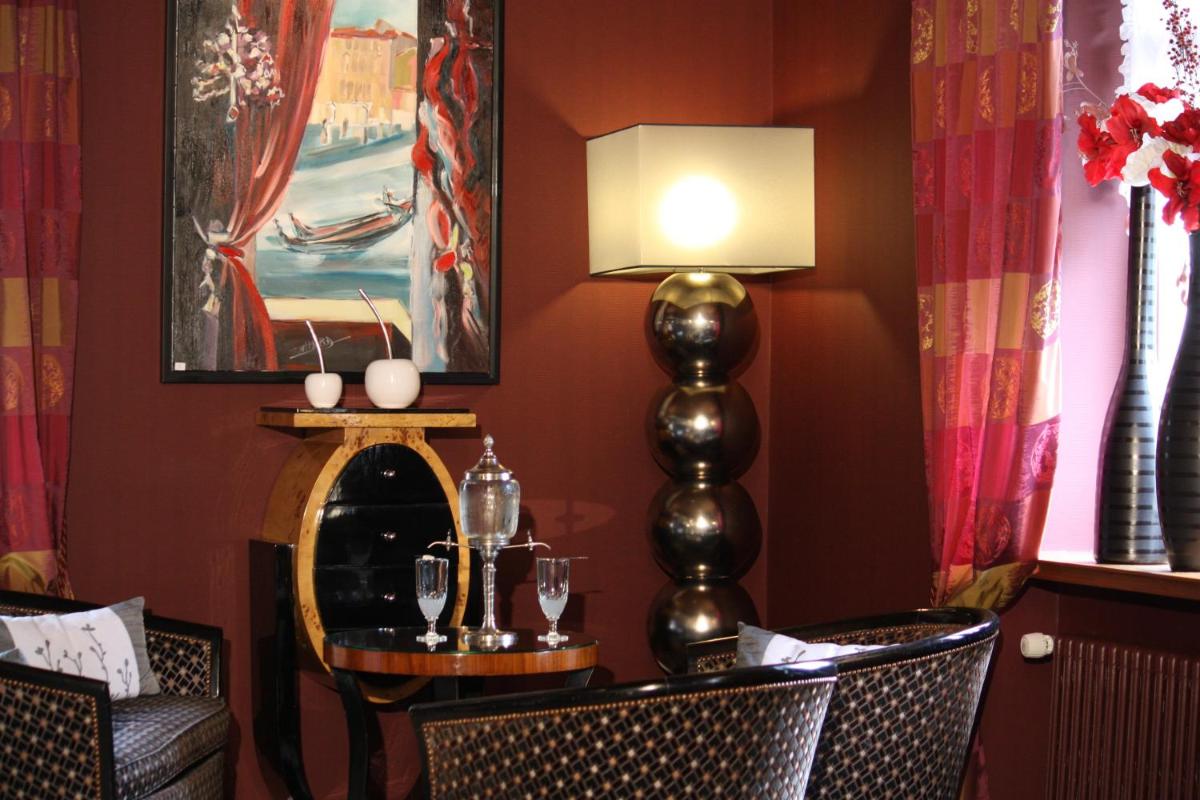 Coin salon dans l'établissement Hôtel Restaurant Taillard