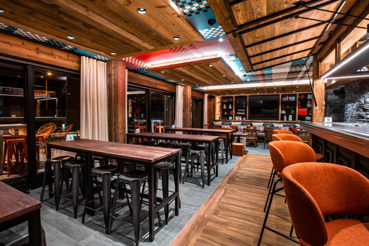 Restaurant ou autre lieu de restauration dans l'établissement Hôtel Névé