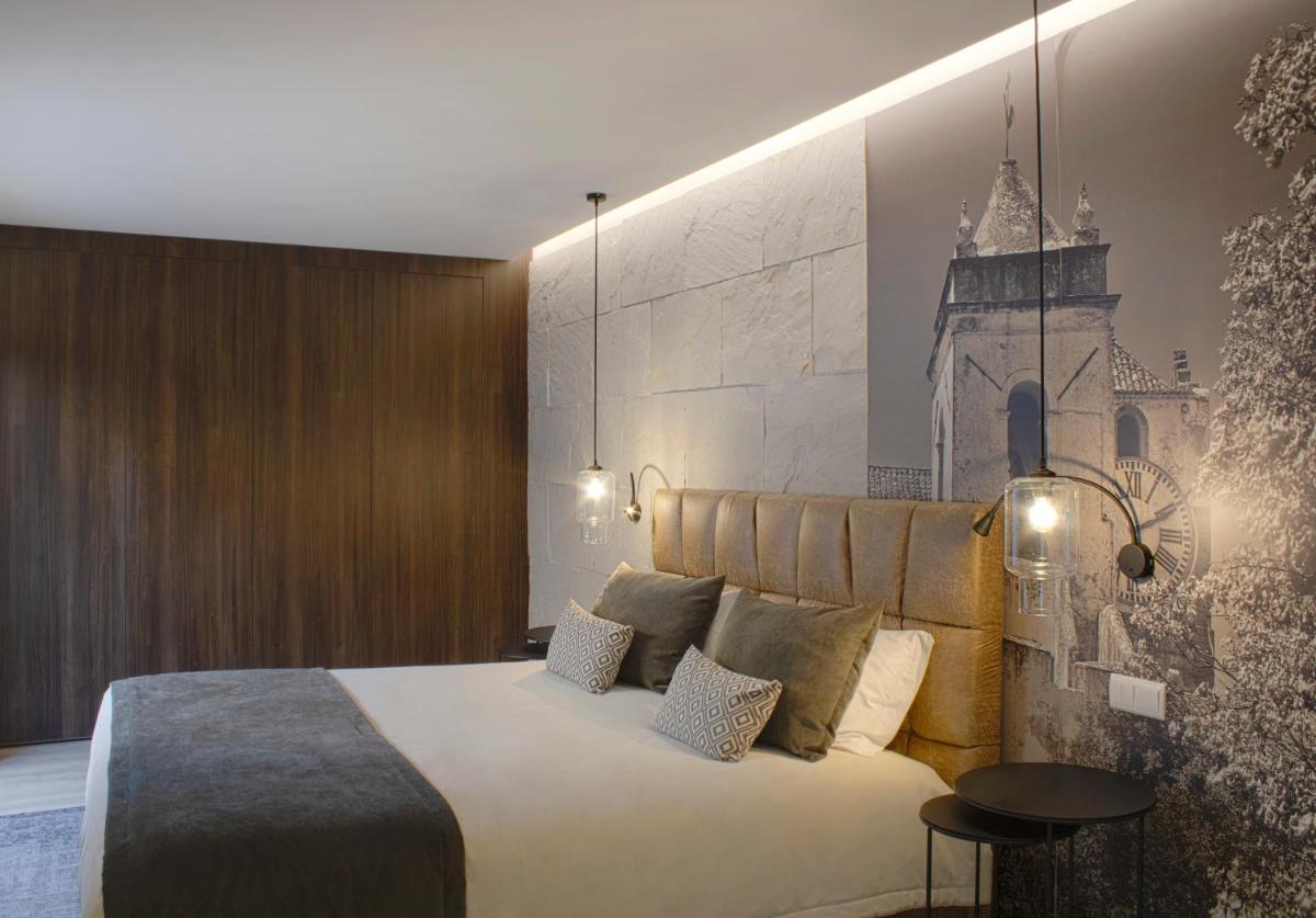 Uma cama ou camas num quarto em AP Maria Nova Lounge - Adults Friendly