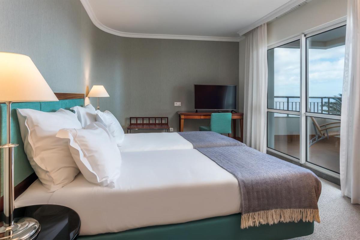 Uma cama ou camas num quarto em Pestana Grand Ocean Resort Hotel