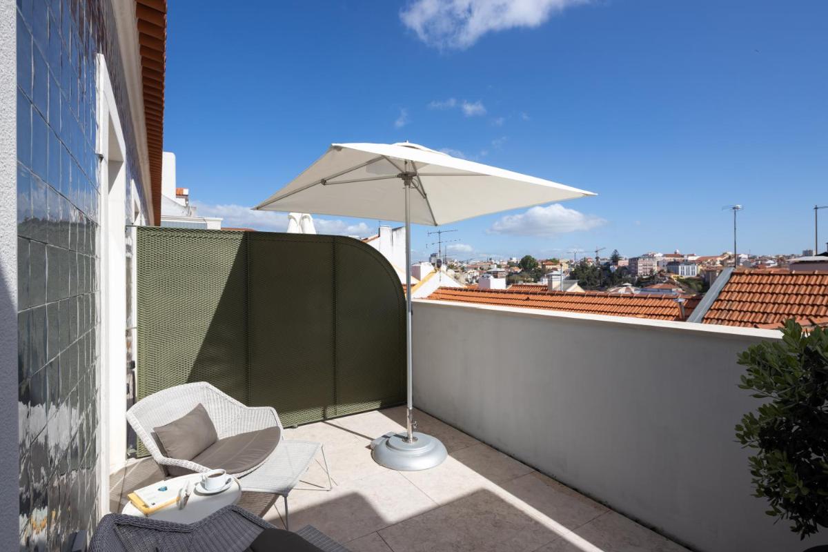 Uma varanda ou terraço em Lisboa Pessoa Hotel