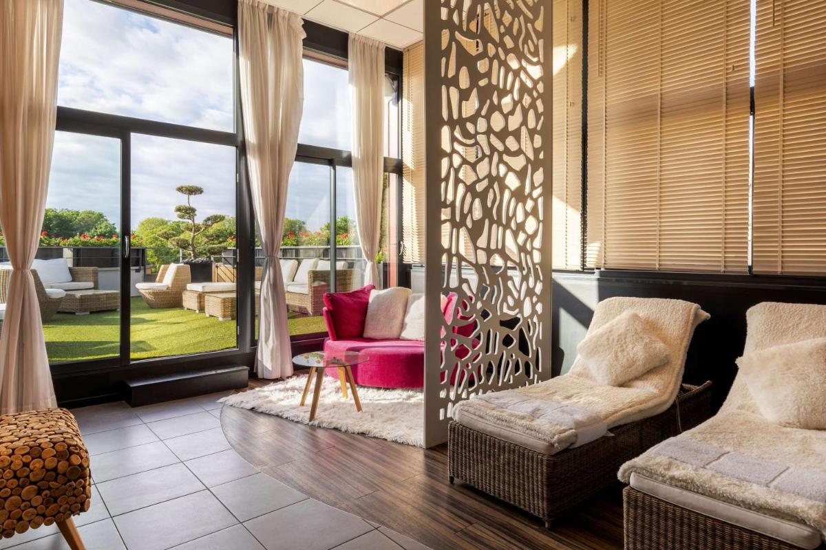 Coin salon dans l'établissement Best Western Plus Thionville Centre