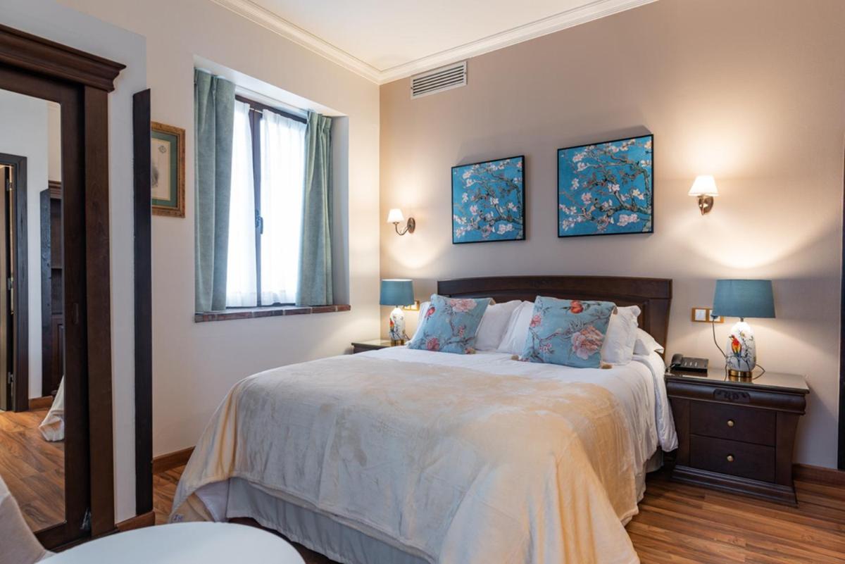 Cama o camas de una habitación en Hotel & Spa María Manuela