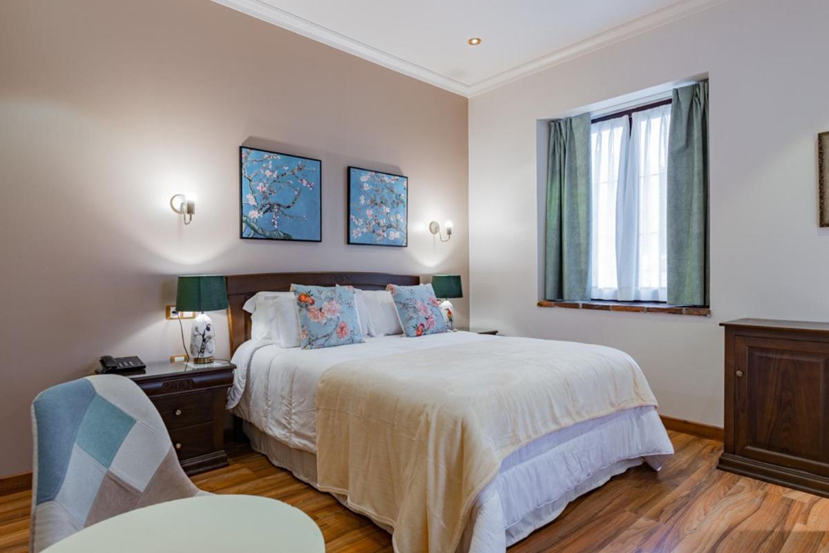 Cama o camas de una habitación en Hotel & Spa María Manuela