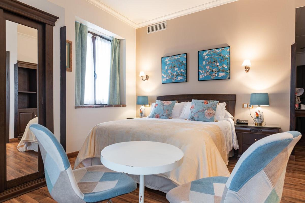Cama o camas de una habitación en Hotel & Spa María Manuela
