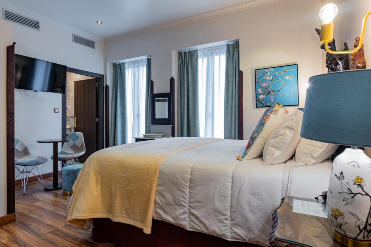 Cama o camas de una habitación en Hotel & Spa María Manuela