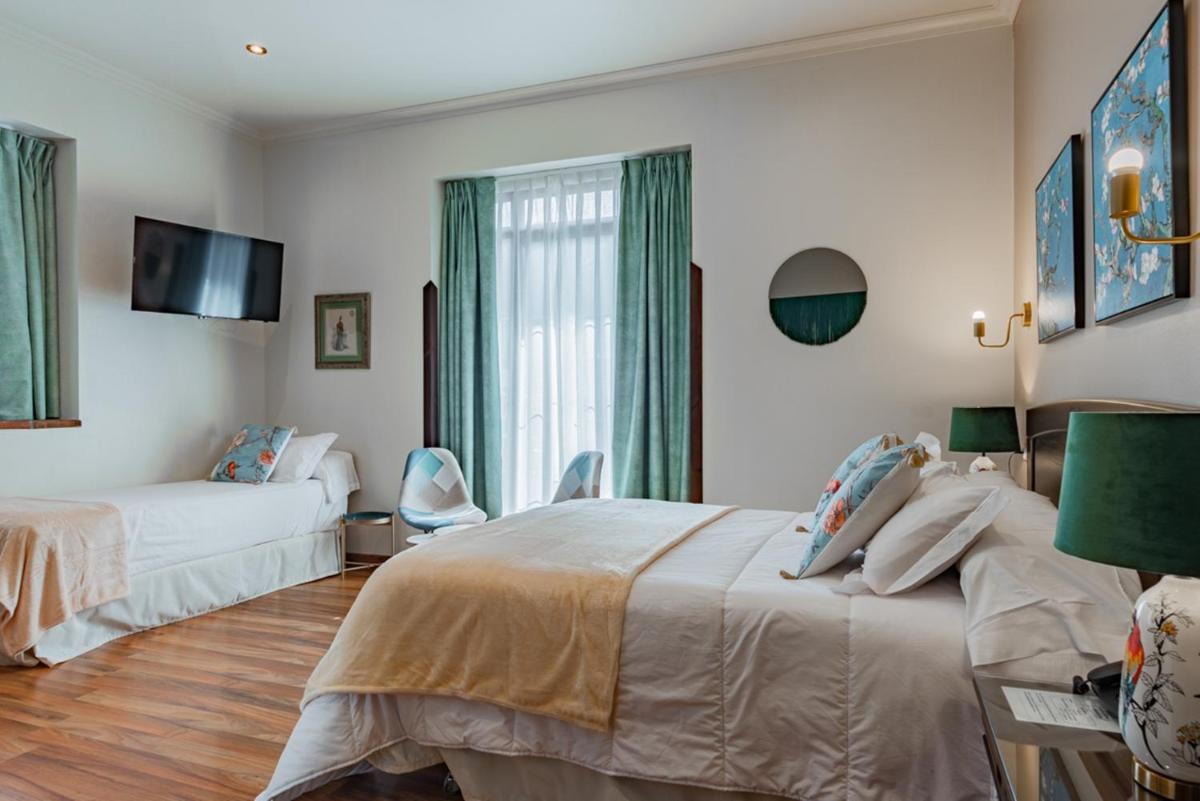 Cama o camas de una habitación en Hotel & Spa María Manuela