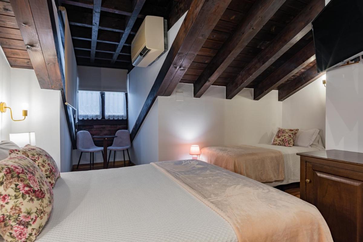 Cama o camas de una habitación en Hotel & Spa María Manuela