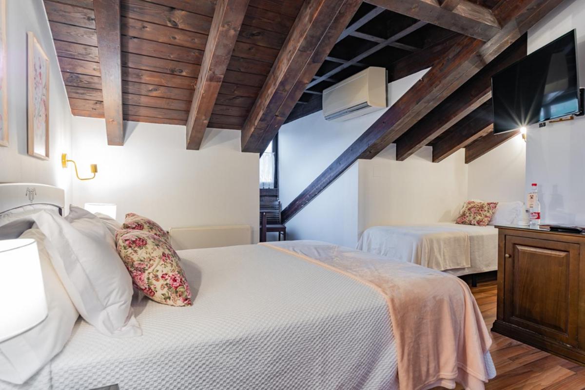 Cama o camas de una habitación en Hotel & Spa María Manuela